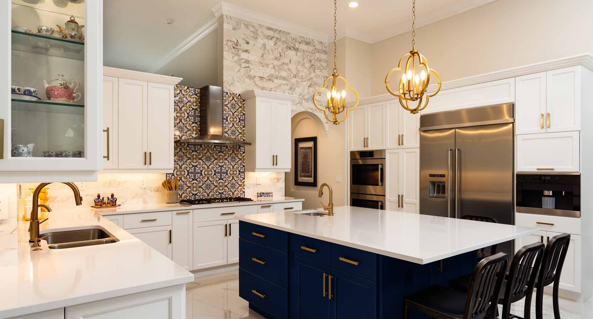 Luxurious kitchen with new white quartz countertops and gold accents