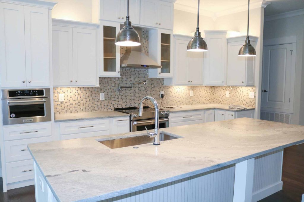 Newly remodeled kitchen with white quartz countertops