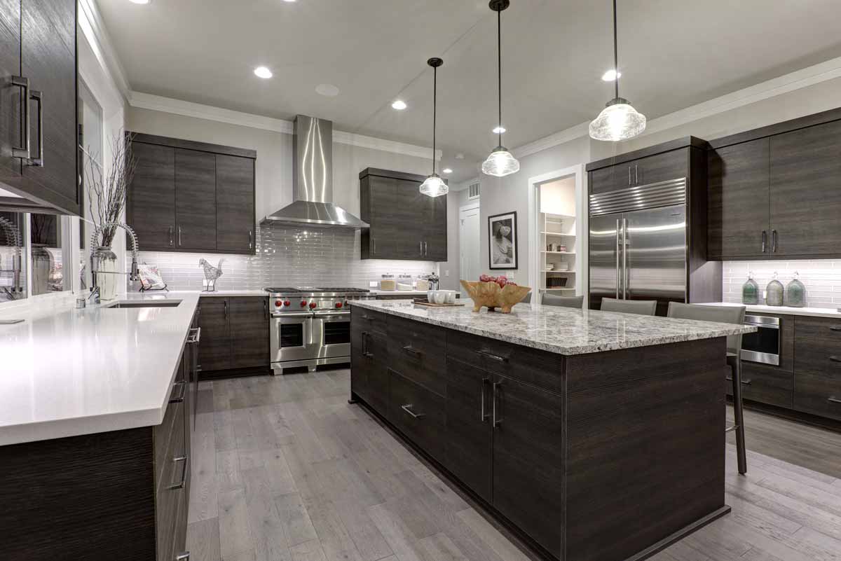 Kitchen with a mixture of white quartz countertops and granite countertops