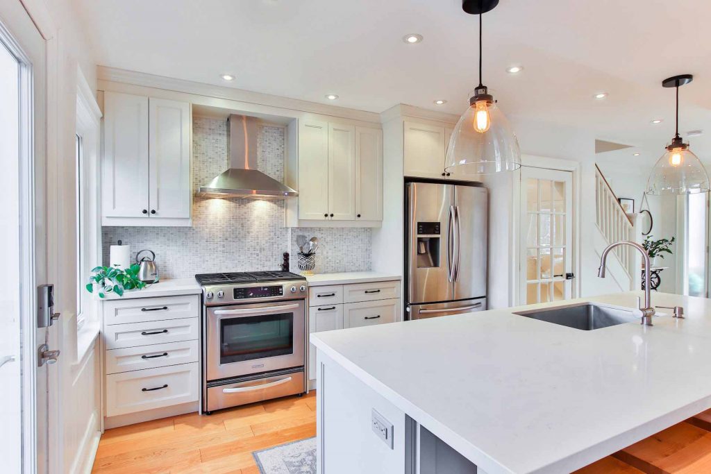 Clean, modern kitchen with white quartz countertops