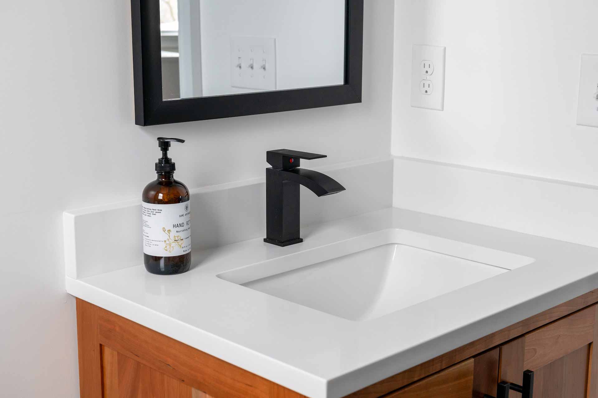 Bathroom sink with white quartz countertop