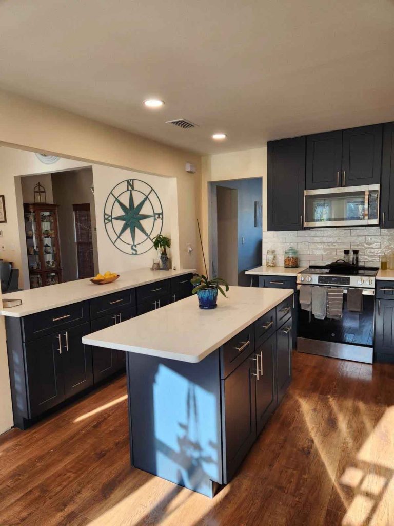 Newly remodeled kitchen with white quartz countertops